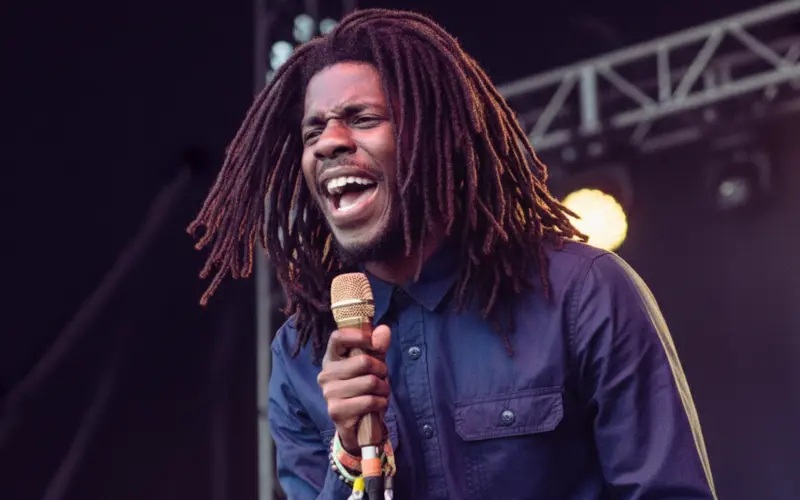 Chronixx performing live on stage, the leading artist in the Conscious Reggae Fusion movement.